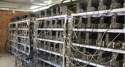 A vast mining farm with rows of mining machines